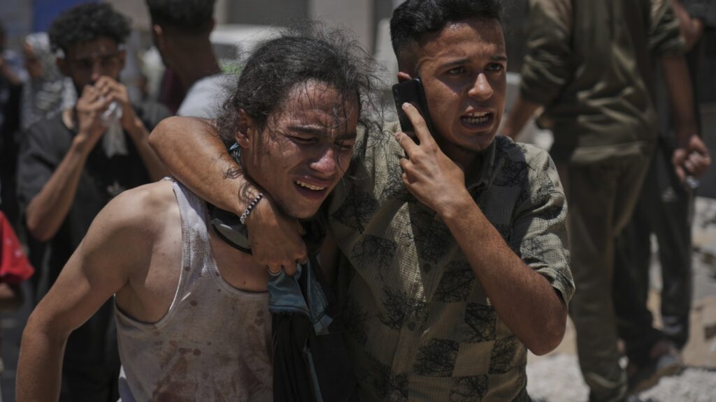 Nearly 100 people killed seeking aid in Gaza on Sunday, Palestinian officials say : NPR