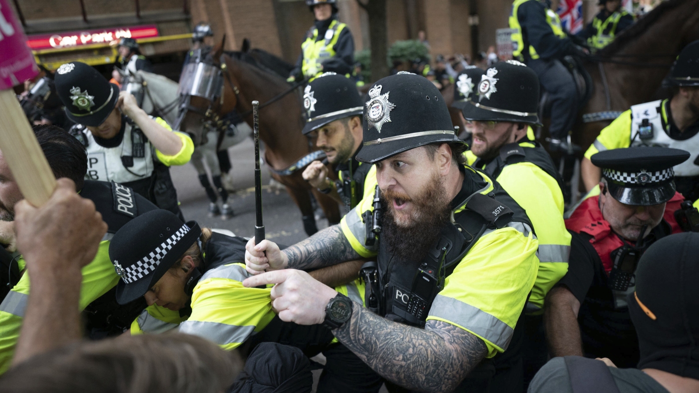 U.K. migrant protests spark angry confrontations : NPR